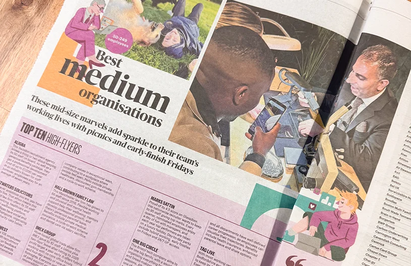 Sunday Times newspaper showing Sunday Times Best Place to Work.