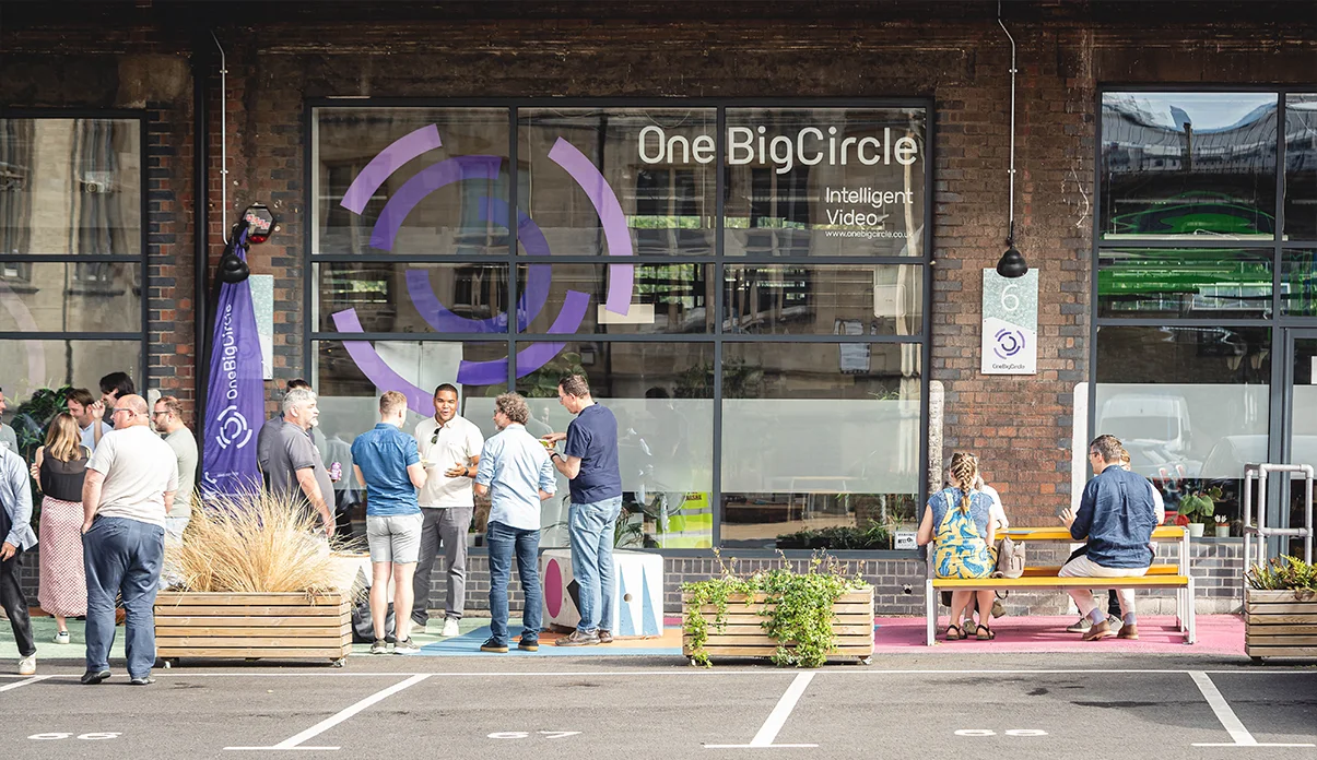 a group of people standing outside One Big Circle's office.